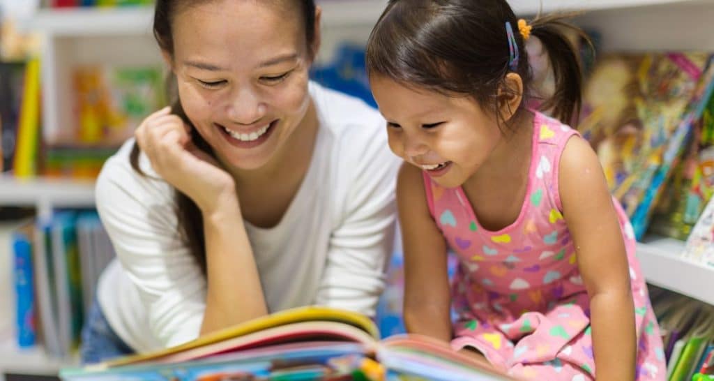 Mother reading to her young child