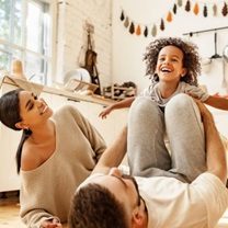 Family playing with their child