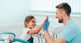 Child giving doctor a high five