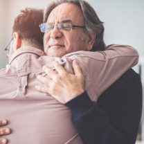 father and son hugging